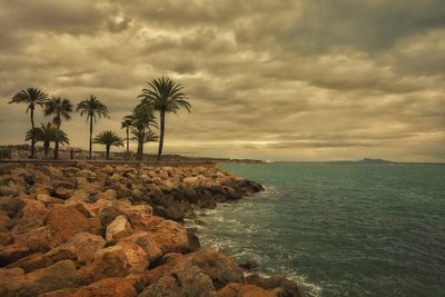 Scenic view of sea against sky at sunset