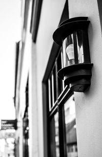 Low angle view of lighting equipment mounted on wall