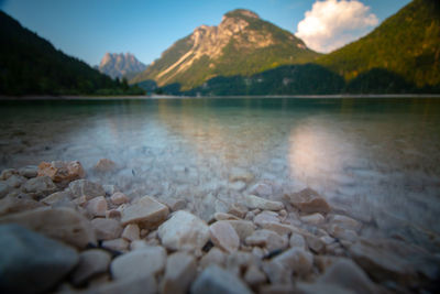 Scenic view of lake and mountains against sky