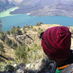 Close-up of woman against mountain range