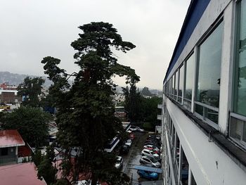 Empty road along buildings