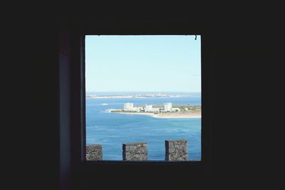 Scenic view of sea seen through window