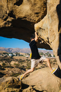 Man climbing on rock