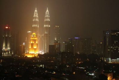 Illuminated buildings in city at night