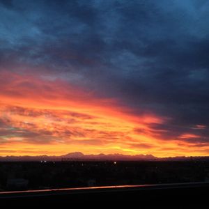 Scenic view of landscape against cloudy sky