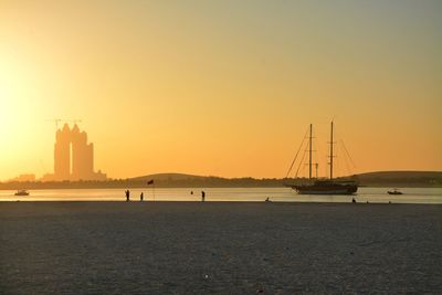 Scenic view of beach against sky during sunset