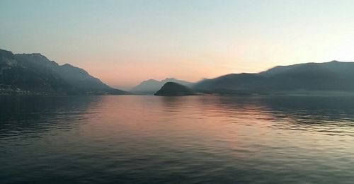 Scenic view of lake against sky during sunset