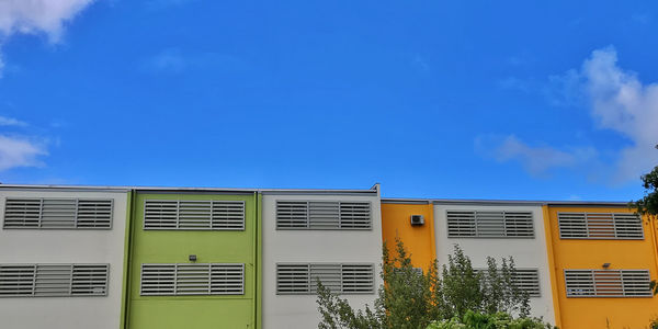 Low angle view of building against blue sky