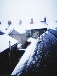 Close-up of snow on road against sky