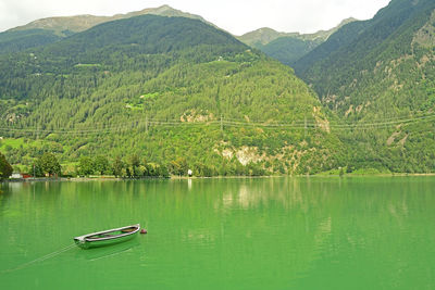 Scenic view of lake by mountains