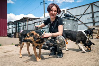 Dog at the shelter. animal shelter volunteer feeding the dogs.  