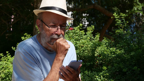 Senior man using mobile phone 