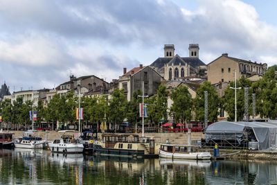 Boats moored at harbor
