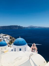 Panoramic view of sea and buildings against sky