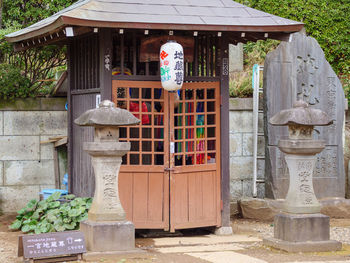 Entrance of temple against building