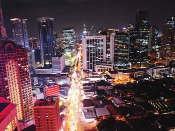 High angle view of illuminated buildings in city at night