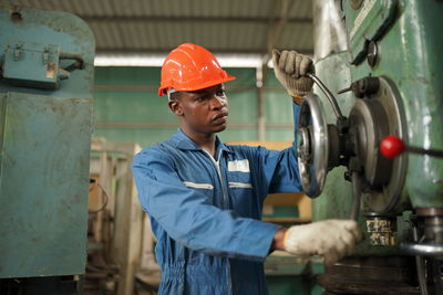 Portrait of man working in factory