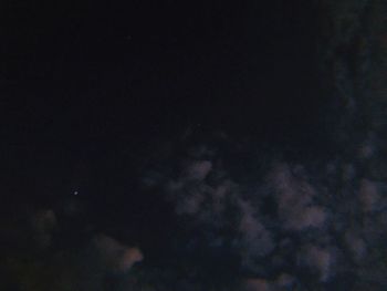Low angle view of moon in sky at night