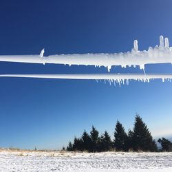 Scenic view of sea against blue sky