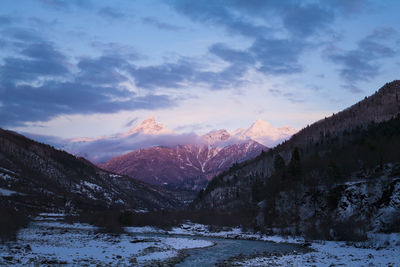 Scenic view of mountains against sky during winter