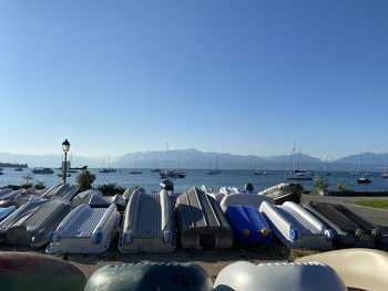 Sailboats on sea against clear blue sky