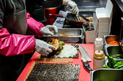 Man working in kitchen at restaurant