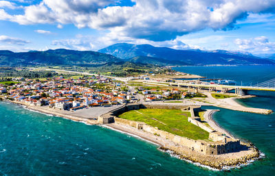 High angle view of buildings by sea