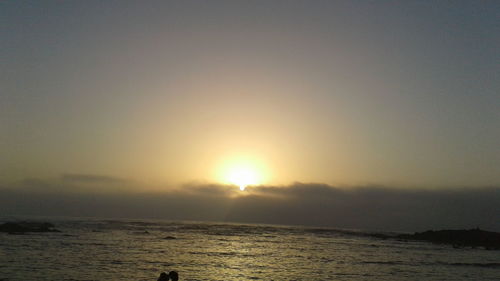 Scenic view of sea against clear sky during sunset