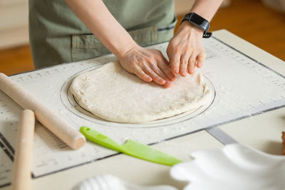 Midsection of man preparing food on table