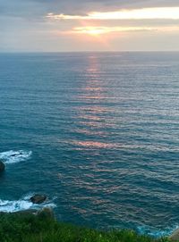 Scenic view of sea against dramatic sky