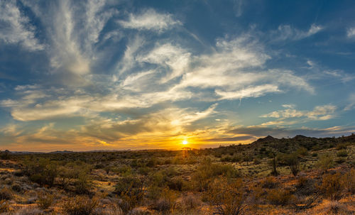 Scenic view of landscape against sky during sunset