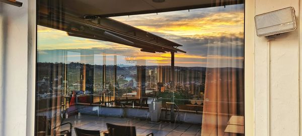 Reflection of building on glass window