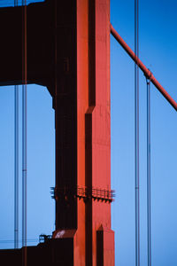 Low angle view of bridge against clear blue sky