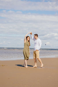 Couple of a man and a woman on a date on the beach by the sea.  walk picnic of two lovers in nature