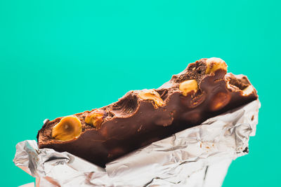 Close-up of cake against white background