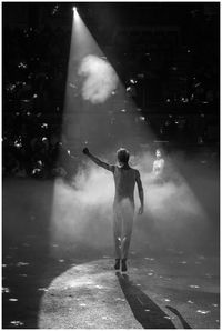 Full length of man standing at illuminated street