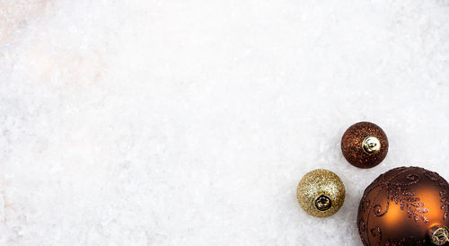 High angle view of baubles on snow