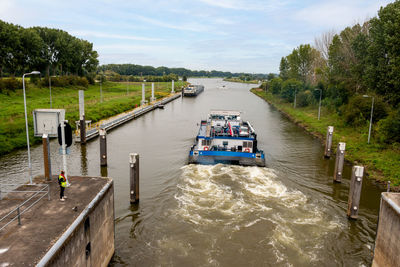 A boat sails through the sluice at the river the maas in the city of roermond, the netherlands