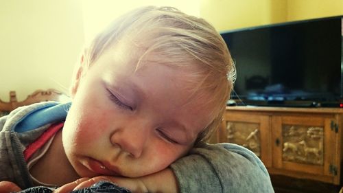 Close-up of young child sleeping at home