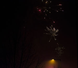 Low angle view of illuminated lights at night