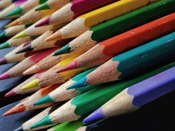 Close-up of colored pencils on table