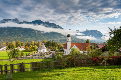 Panoramic view of houses and buildings against sky