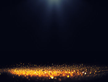 Defocused image of illuminated music concert at night