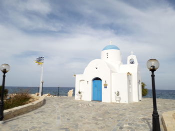 View of bell tower against cloudy sky