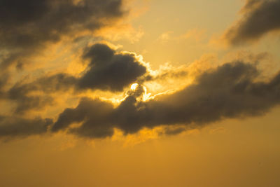 Low angle view of dramatic sky during sunset