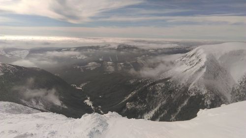 Scenic view of mountains against sky during winter