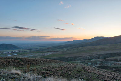 Scenic view of landscape against sky during sunset