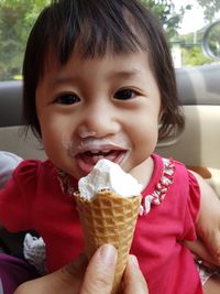 Portrait of cute girl eating ice cream