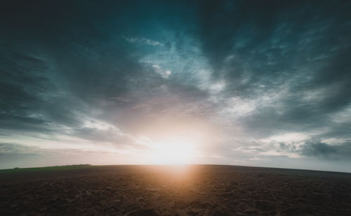 Scenic view of sunset over land