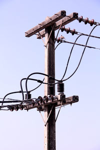 Low angle view of street light against sky